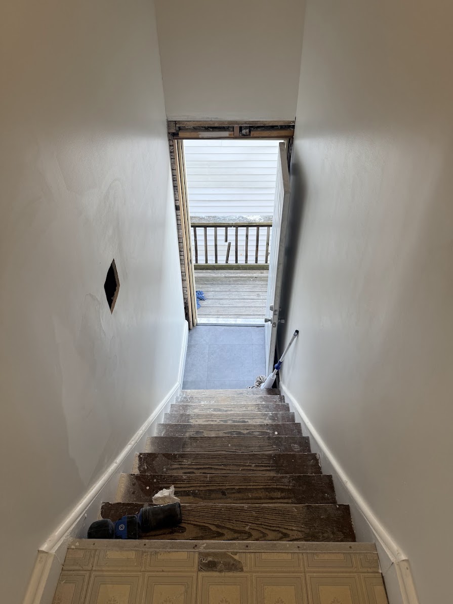 Stairwell after drywall installation and finishing, shared in a customer review