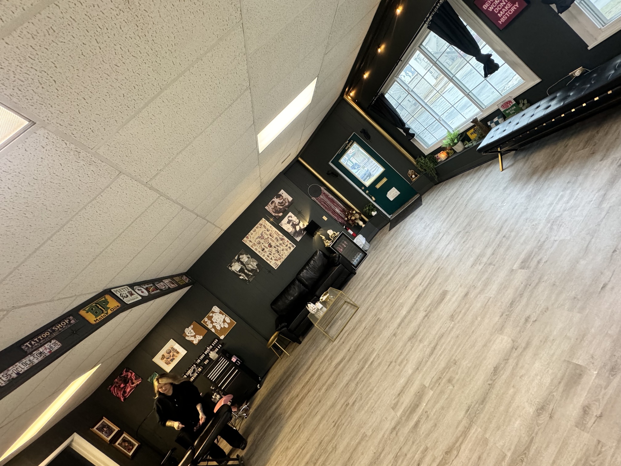 Commercial interior with dark freshly painted walls, shared in a customer painting review